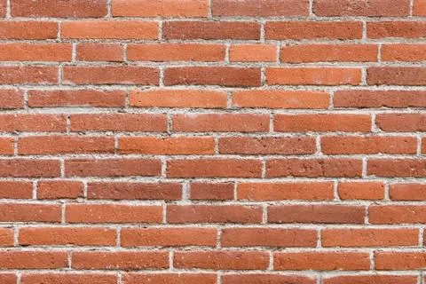 Wall made from orange bricks Fotos de archivo