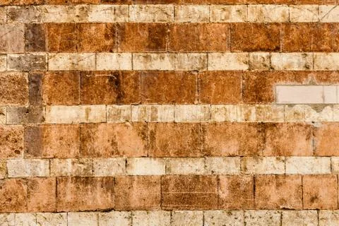Wall made of orange bricks. Stock Photos