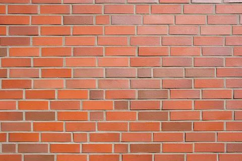 Wall made of orange clinker bricks Stock Photos