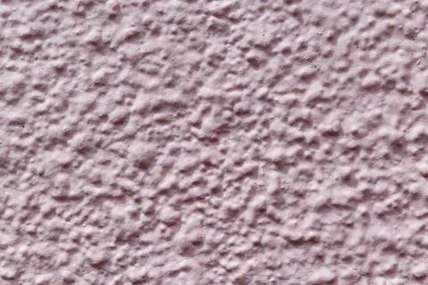 The wall is made of plaster and painted pink or beige paint. Stock Photos