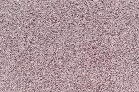 The wall is made of plaster and painted pink or beige paint. Stock Photos