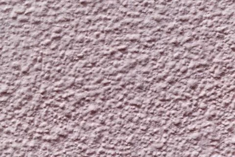The wall is made of plaster and painted pink or beige paint. Stock Photos