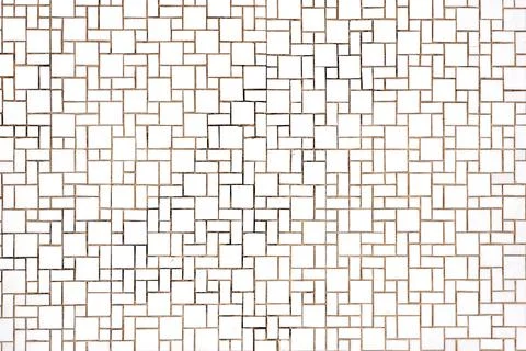 Wall made of rectangular and square white mosaic tiles Foto stock