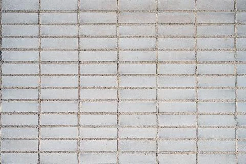 Wall made of rectangular beige mosaic tiles Stock Photos
