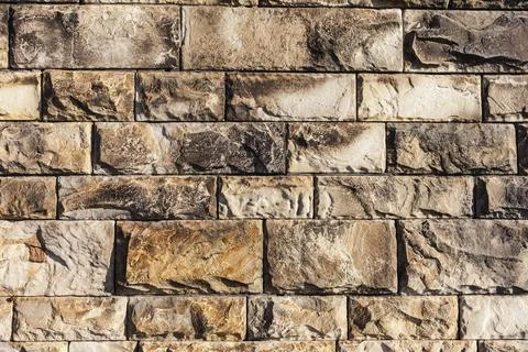 Wall made from rectangular granite blocks, background or texture design element Foto stock