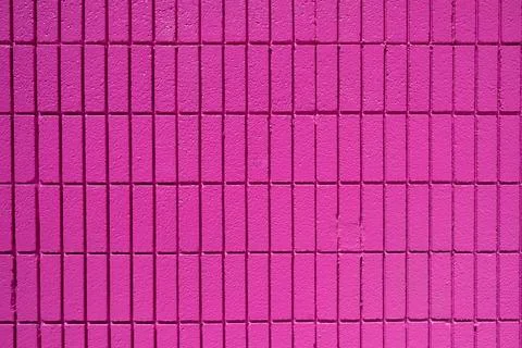 Wall made of rectangular pink mosaic tiles Foto stock