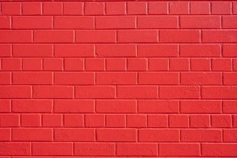Wall made of red painted bricks Stock Photos