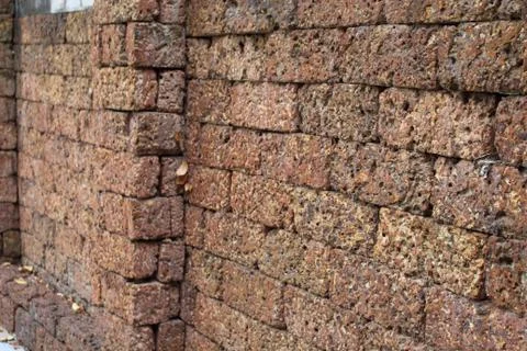 Wall made of red stone. Stock Photos