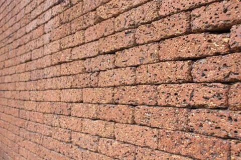 Wall made of red stone. Stock Photos