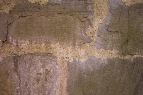 A wall made of rough stone. Stock Photos