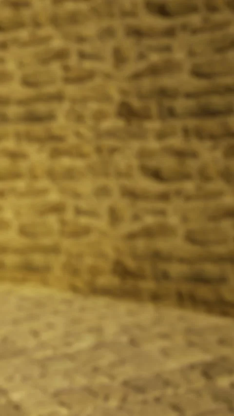 A wall made of rough stones and earthy colors can be seen in a building Video stock 331767475