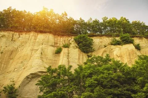 Wall made of sand, sand cliff. High quality photo Stock Photos