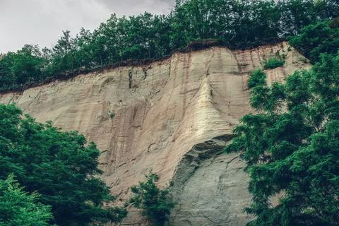 Wall made of sand, sand cliff. High quality photo Stock Photos