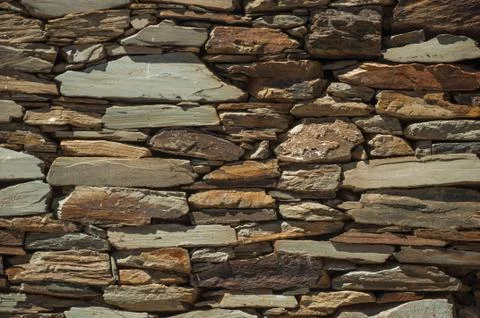 Wall made of slate stone making a quaint pattern Stock Photos