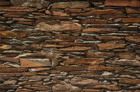 Wall made of slate stone making a quaint pattern Stock Photos