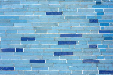 Wall made of small blue stone tiles Stock Photos
