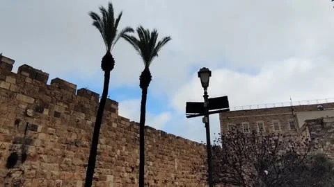 A wall made of stone blocks with a building in the background. Jerusalem ol.. Stock Footage 325132754