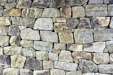 A wall made of stone blocks Stock Photos