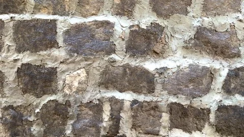 A wall made of stone with a rough texture Stock Footage 312923148