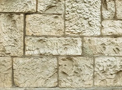 A wall made of stone with a rough texture Stock-Fotos