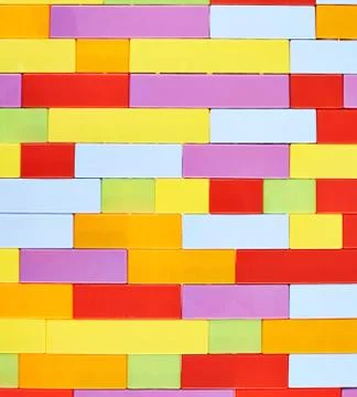 Wall made of toy construction bricks Stock Photos