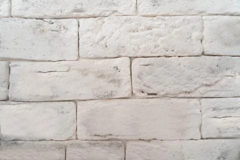 The wall is made of white rectangular blocks 스톡 사진