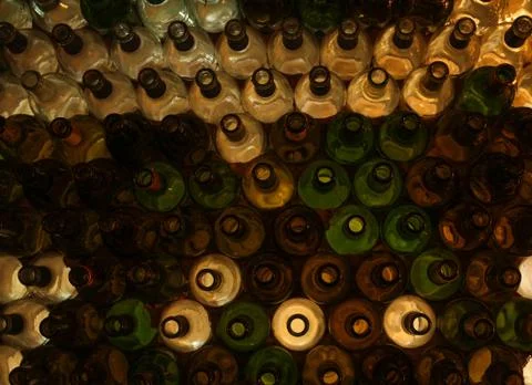 Wall made of wine bottles with different colors Foto stock