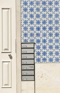 The wall with mailboxes of an old house in Lisbon, Portugal. Stock Photos