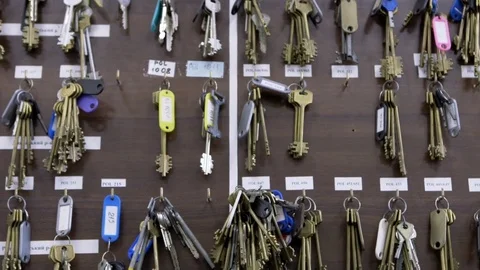 Wall with many rows of keys with numbers, labels and stickers in dispatch of Stock Footage 82263485