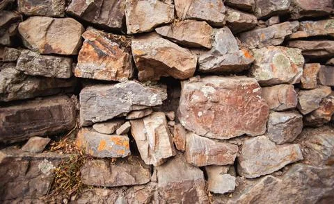 Wall of medium size stones Stock Photos