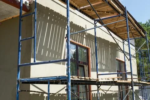 Wall mesh for plaster, facade render application, external scaffolding, ins.. Stock Photos