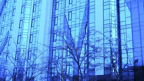 Wall Of A Mirrored Skyscraper In An Inspiring Blue Tone Stock Footage 104047408