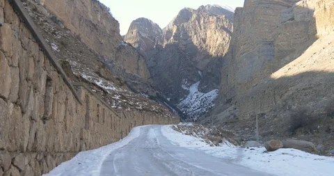 Wall monument and ice road leading to the rocks Stock Footage 85598973