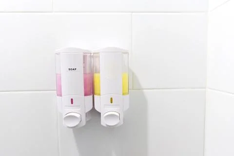 Wall Mount Shower Pump Shampoo and  Soap Dispensers in bathroom Stock Photos