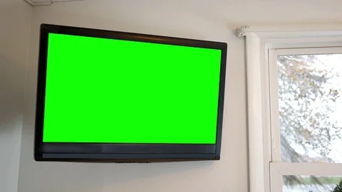 Wall mounted 4K UHD TV on wall in bedroom Stock Footage 82325793
