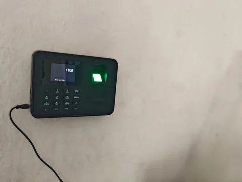 Wall-Mounted Biometric Attendance Device with Fingerprint Scanner Stock Photos