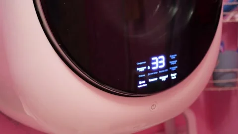 Wall Mounted Compact Washing Machine Spinning at High Speed with Vibration Stock Footage 321528586