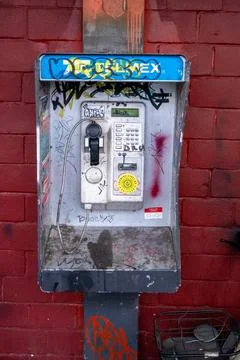 Wall Mounted Digital Interface on a Red Brick Street Facade in Central 스톡 사진