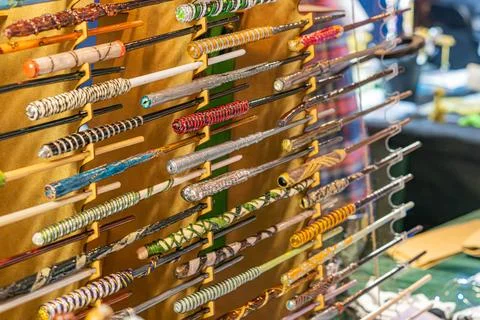 Wall-mounted display of Harry Potter magic wands, each with unique designs .. 写真素材