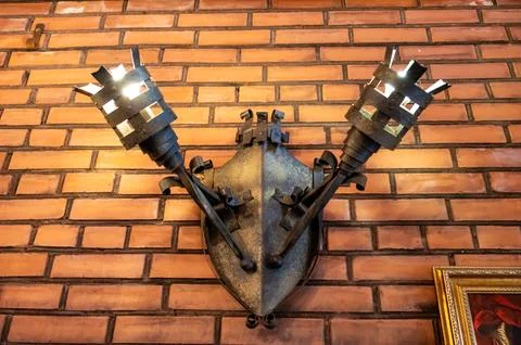 Wall Mounted Double Wrought Iron Chandelier Rustic Medieval Style Shaped Torc Stock Photos