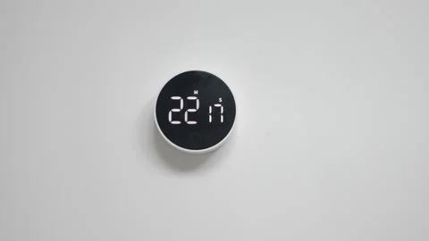 Wall mounted electronic black white clock with minimalistic design, with reverse Stock Footage 219254400