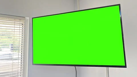 A Wall Mounted Green Screen Tv in Business Lobby Vídeo Stock 336960847