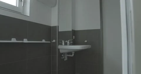 Wall Mounted Sink Behind a Mirror, Modern Tiled Bathroom, Slow Tracking Move Stock Footage 340360528
