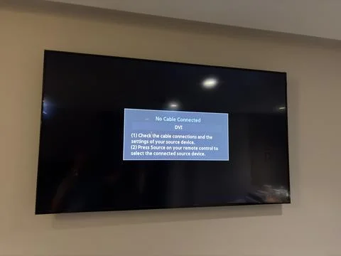 Wall mounted television displaying an error screen Stock Photos