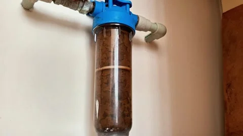 Wall Mounted Water Filter with Contaminated Cartridge and Pipes Video stock 331232573