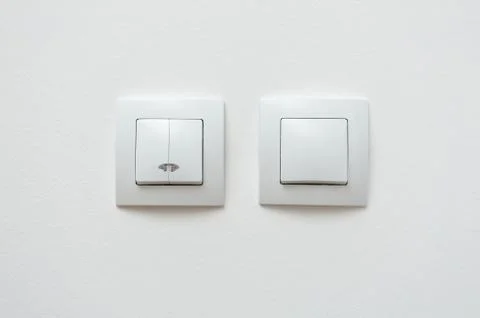 Wall mounted white light switch whith idicator Stock Photos