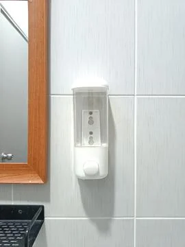 Wall-mounted white soap Stock Photos