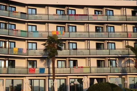 Wall with multiple windows and balconies Stock Photos