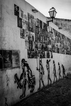 Wall mural depicting human evolution with modern twist and colorful flyers .. Stock Photos