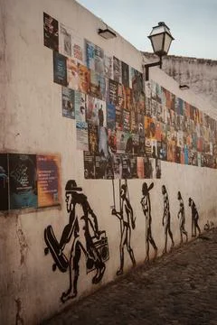 Wall mural depicting human evolution with modern twist and colorful flyers .. Stock Photos